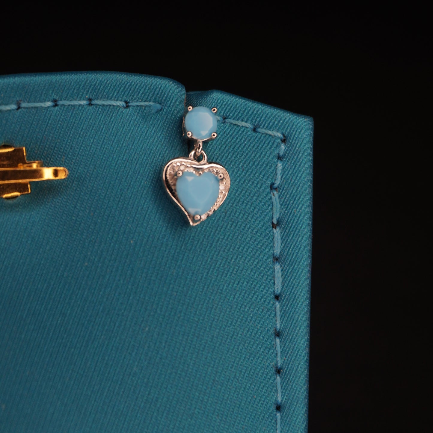 Sky blue stone with heart shaped drops