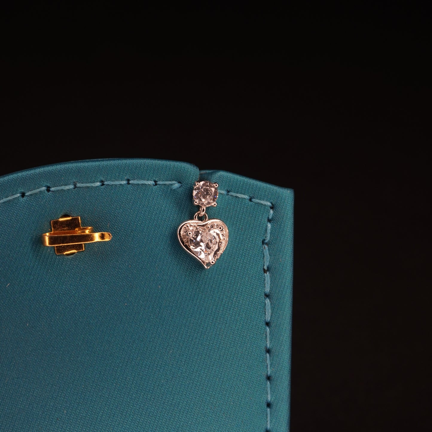 White stone with heart shaped drops