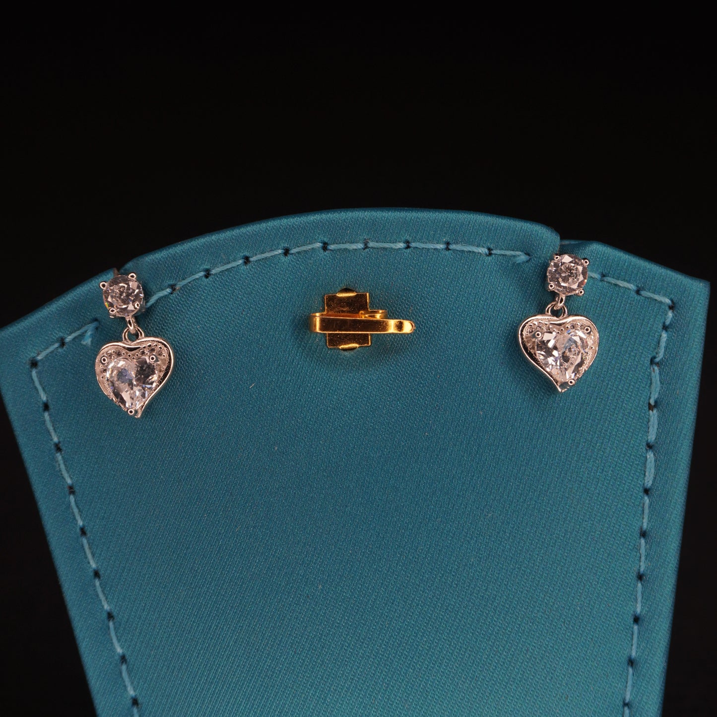 White stone with heart shaped drops