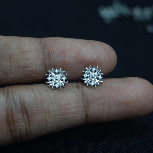 stud with floral pattern