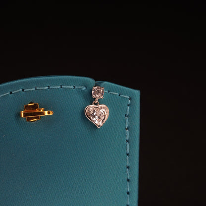White stone with heart shaped drops