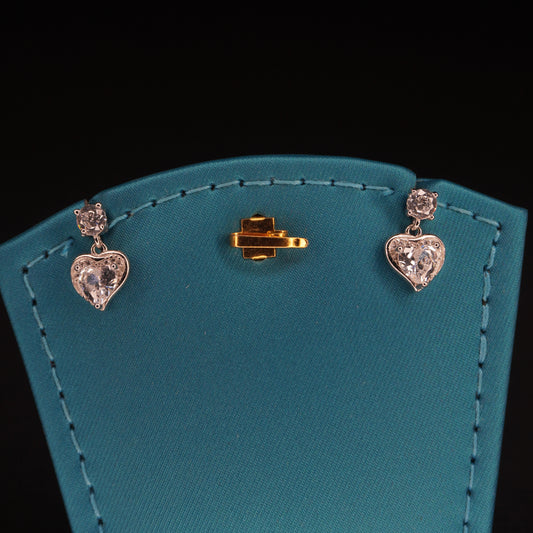 White stone with heart shaped drops