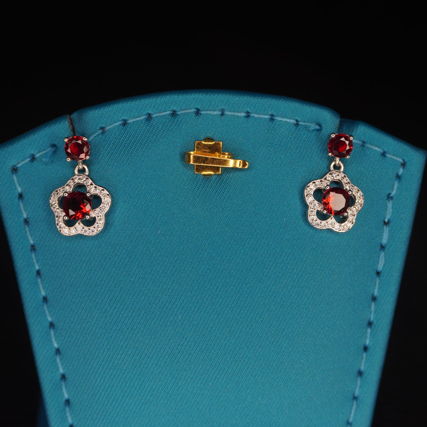Red stone with flowral shaped drops