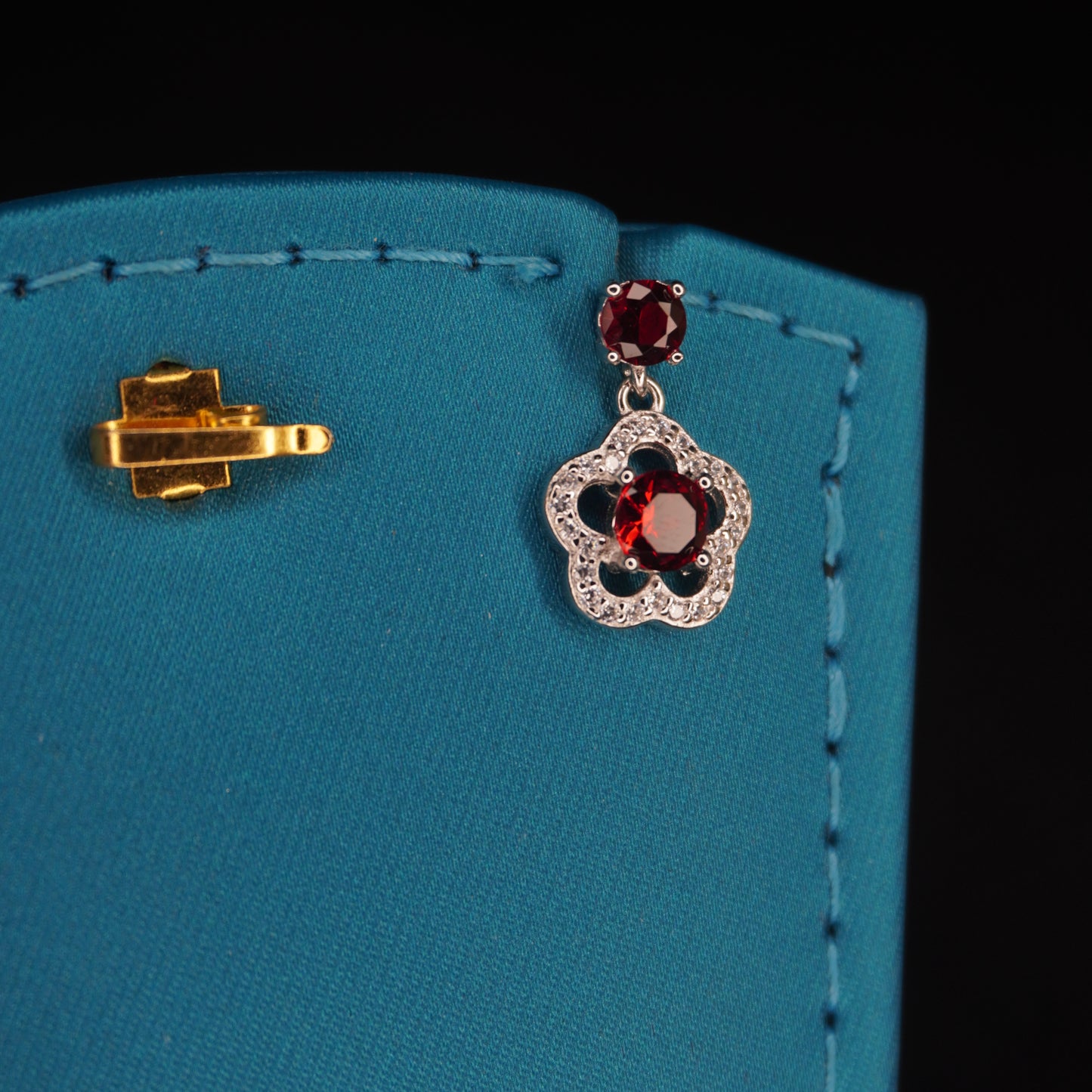 Red stone with flowral shaped drops