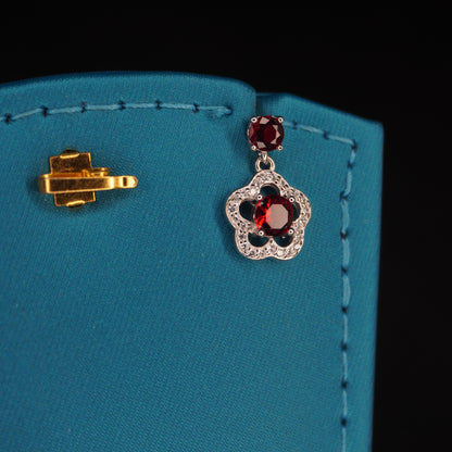 Red stone with flowral shaped drops